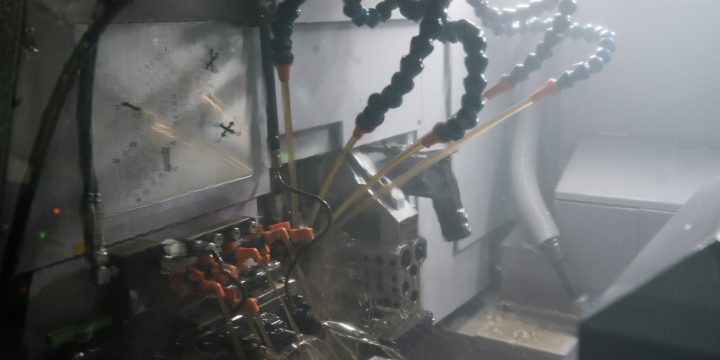 Why do CNC machines use cutting fluid?